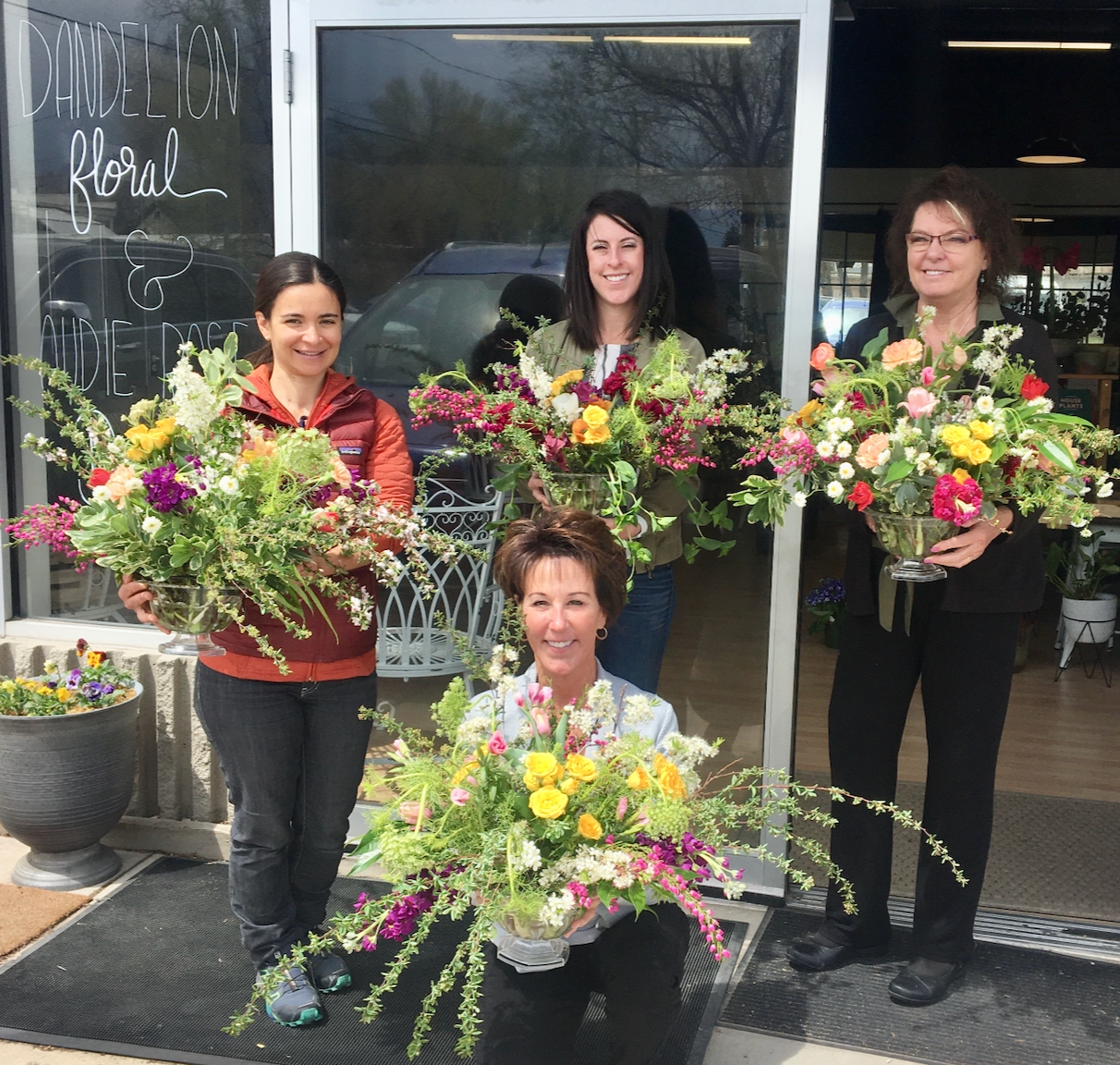 person creating a wreath at a workshop